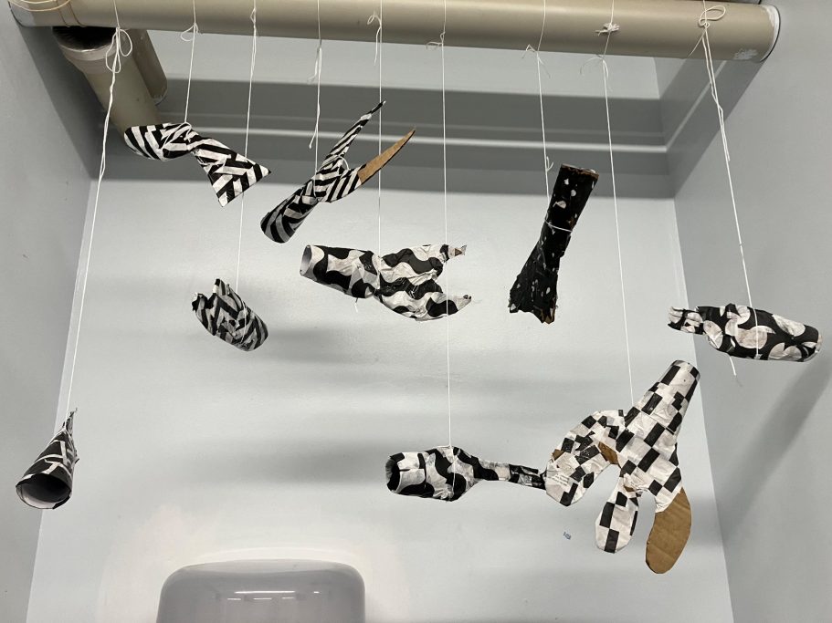 Papier-mashé fish hanging to dry.